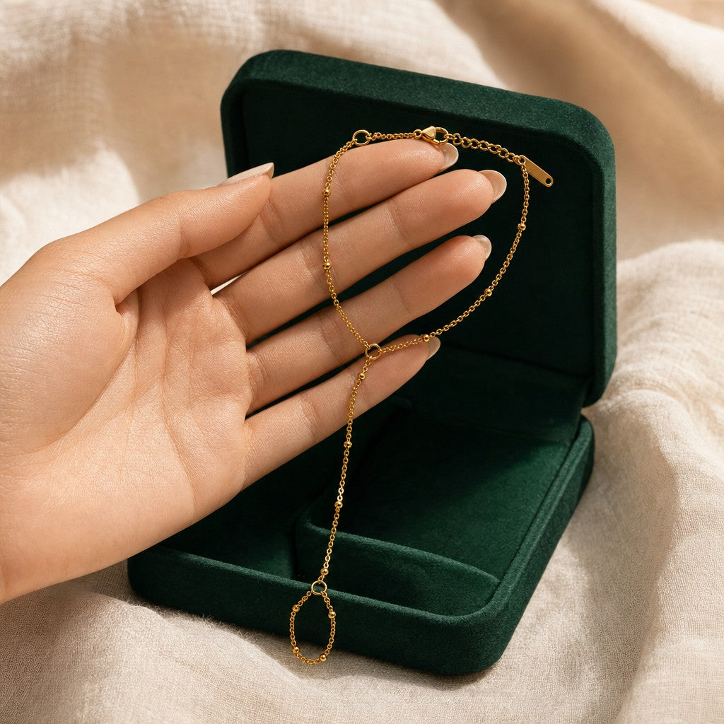 Dotted Hand Chain presented in an plum velvet gift box