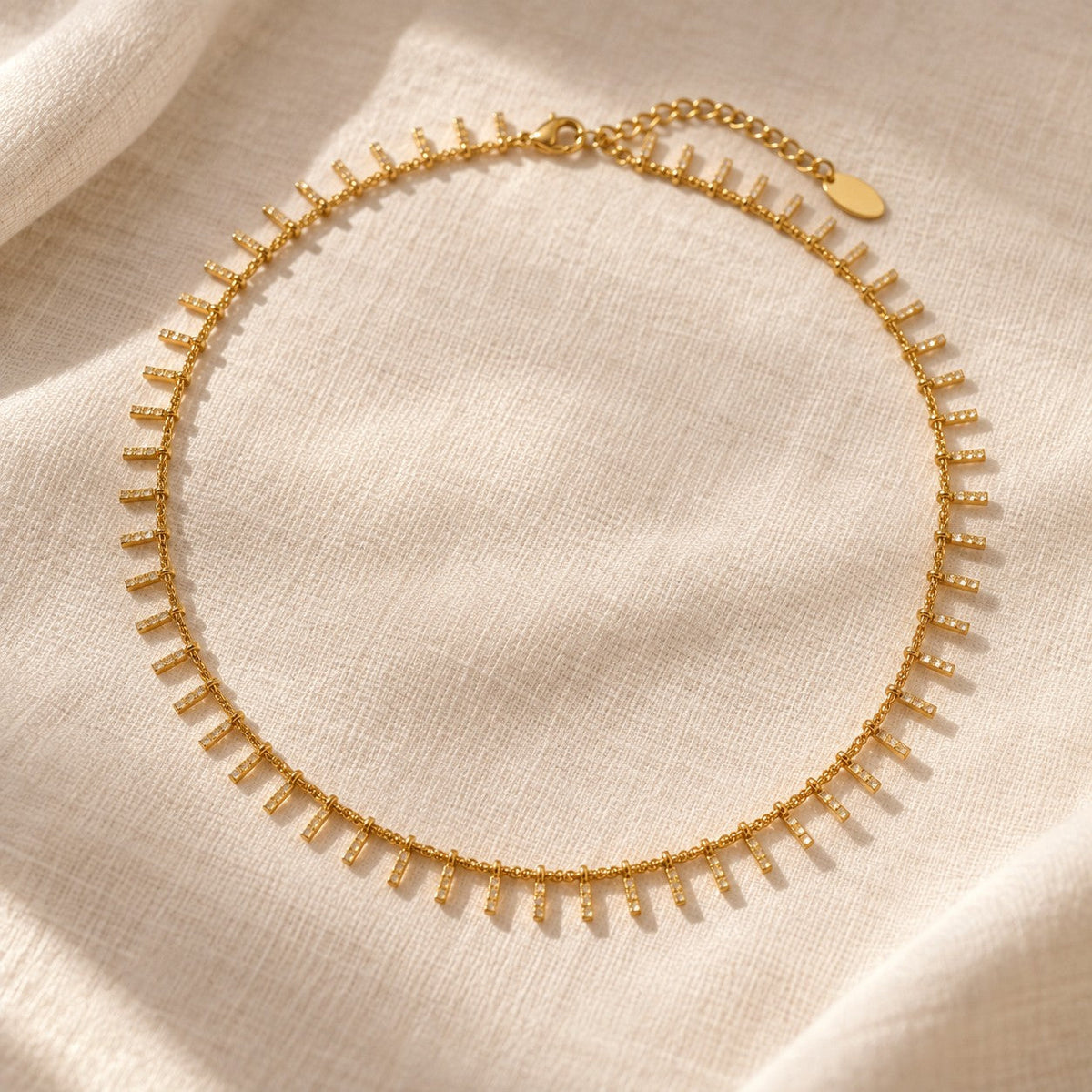 Zayna Dangle Choker on cream linen