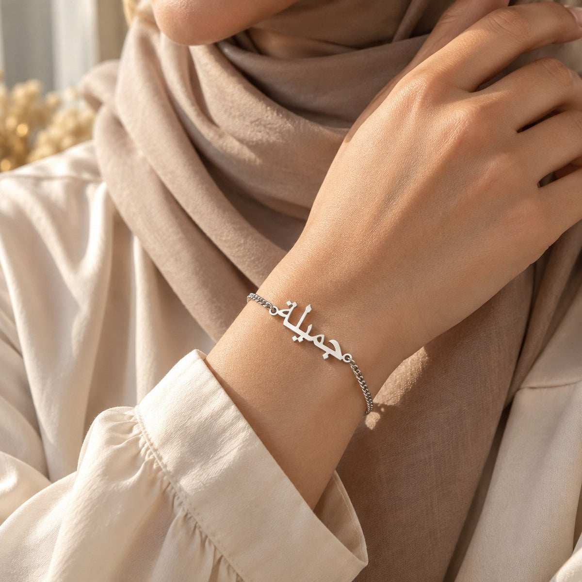 Woman wearing the Custom Name Bracelet in silver