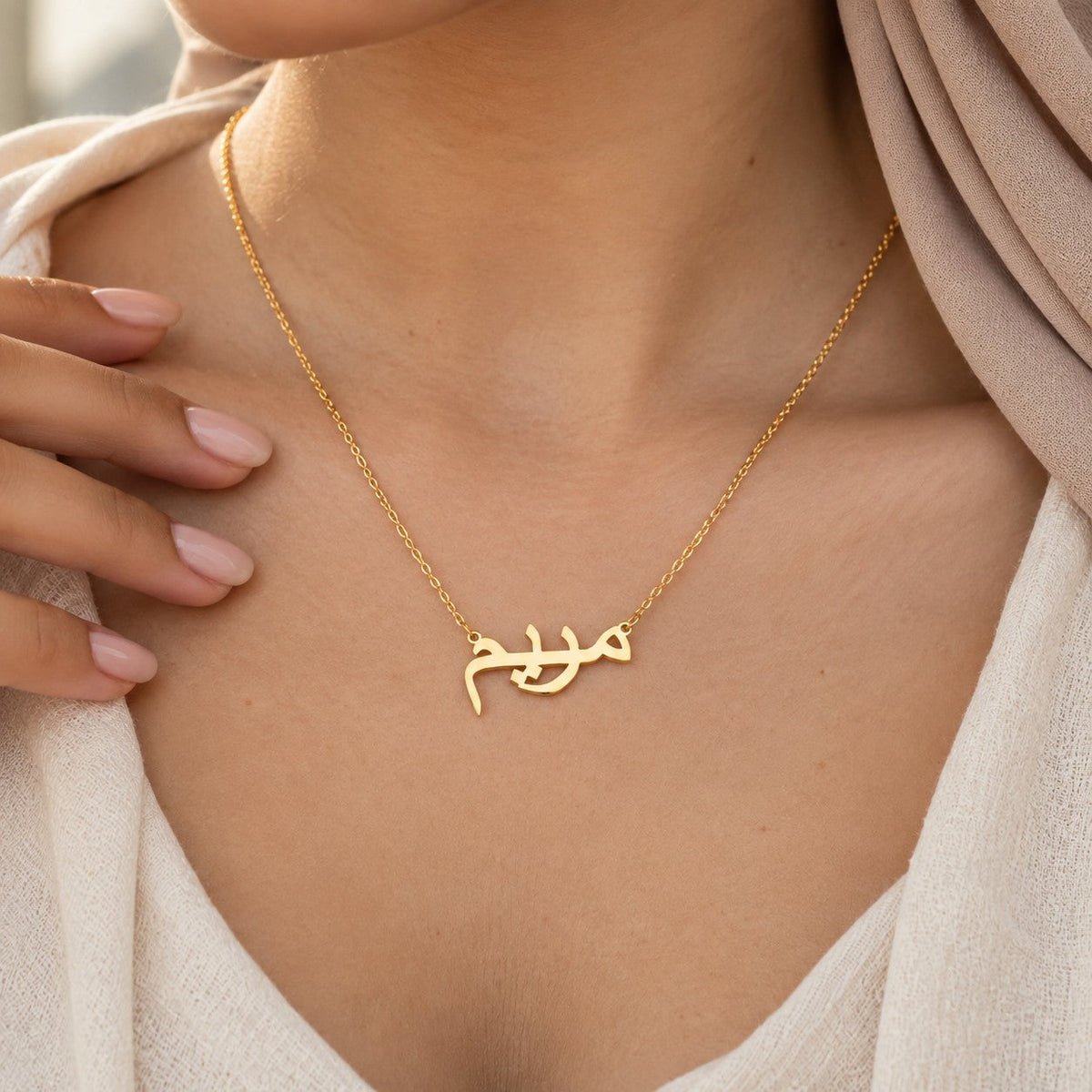 The Custom Name Necklace 18k worn, showing its true size