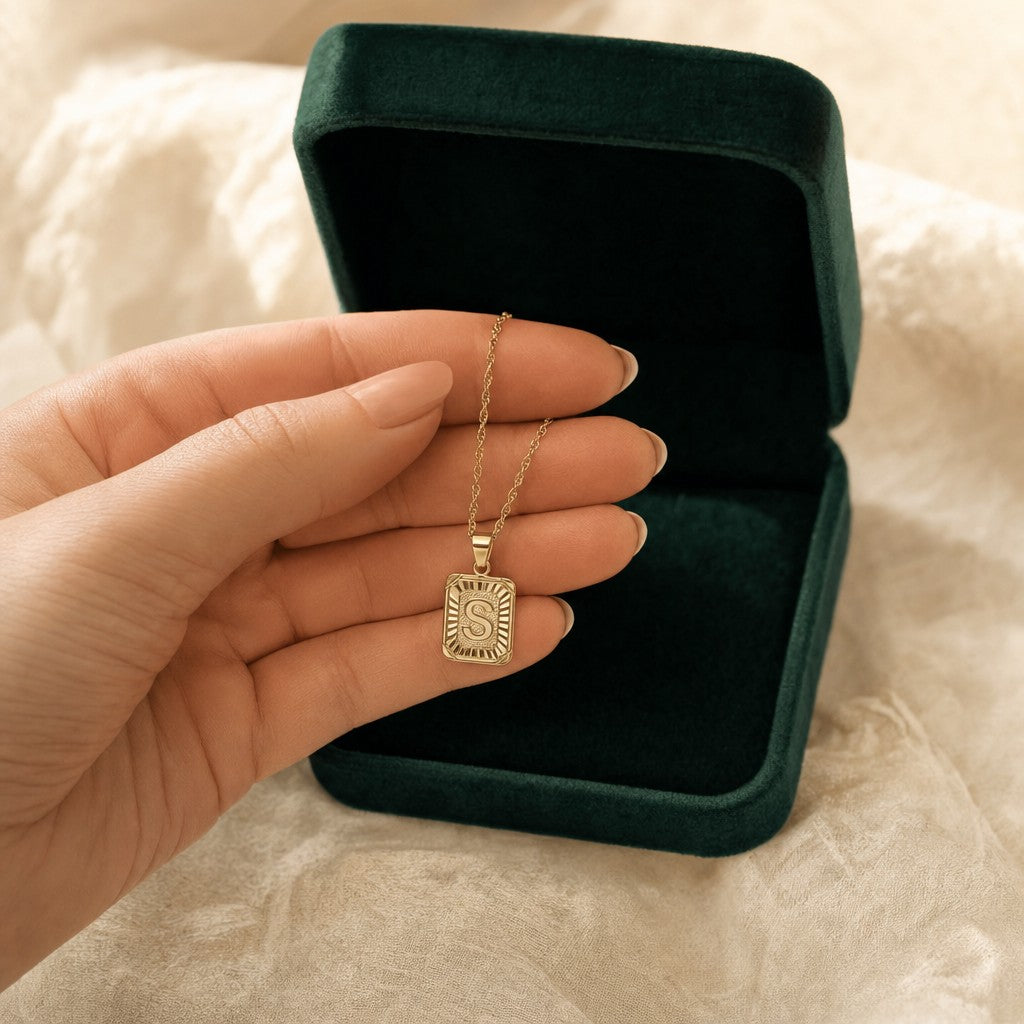 Medallion Initial Necklace presented in an plum velvet gift box