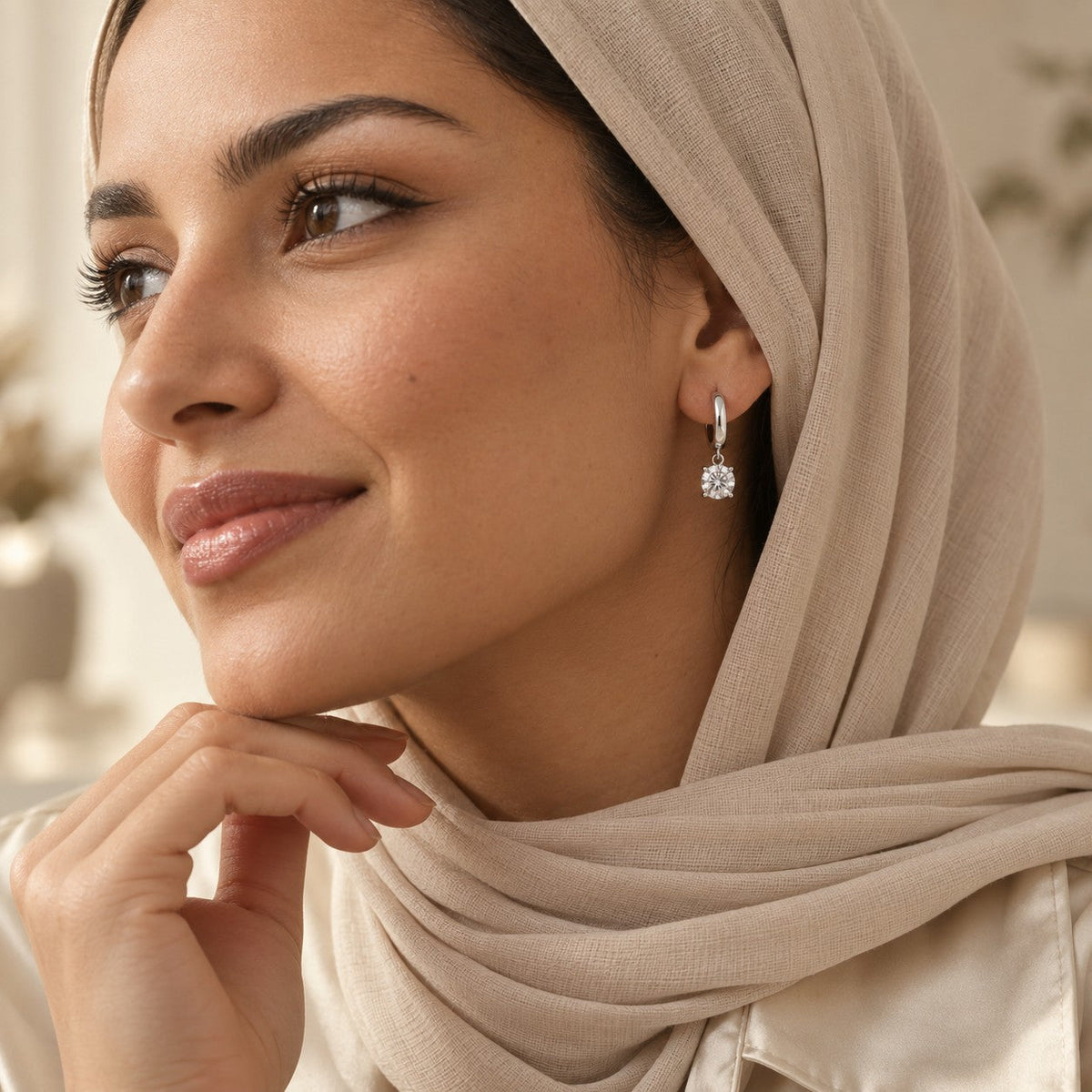 Woman wearing the Soraya Moissanite Drop Hoops
