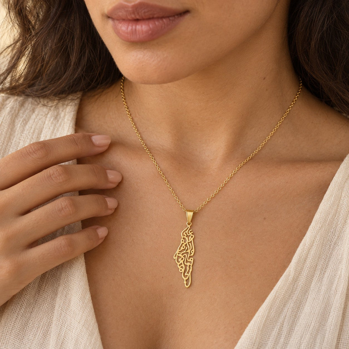 The Palestine Calligraphy Map Necklace worn, showing its true size